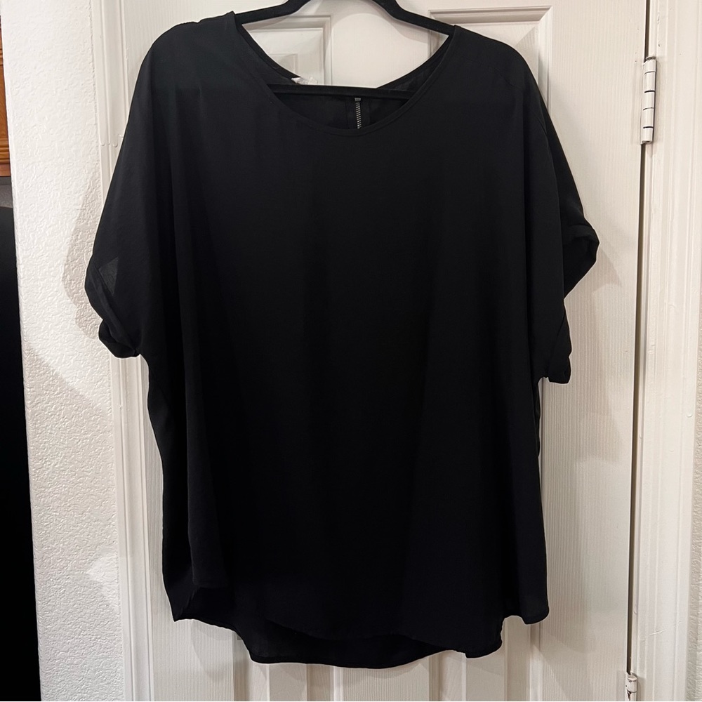 Maurice’s black dolman button sleeve detail top.